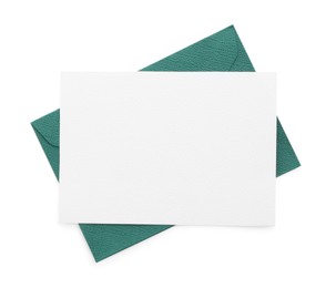 Photo of Blank invitation card and envelope isolated on white, top view. Space for design