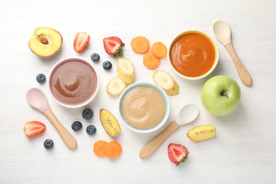 Photo of Baby food. Tasty puree in bowls and different ingredients on white wooden table, flat lay