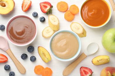 Photo of Baby food. Tasty puree in bowls and different ingredients on white wooden table, flat lay