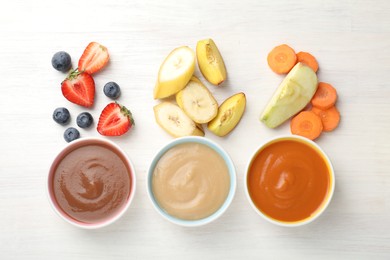 Photo of Baby food. Tasty puree in bowls and different ingredients on white wooden table, flat lay