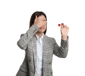 Photo of Targeting. Businesswoman with dart covering eyes on white background
