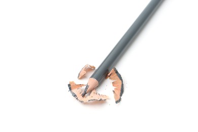 Photo of Beautiful eyebrow pencil and shavings isolated on white