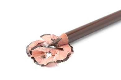 Photo of Beautiful eyebrow pencil and shavings isolated on white