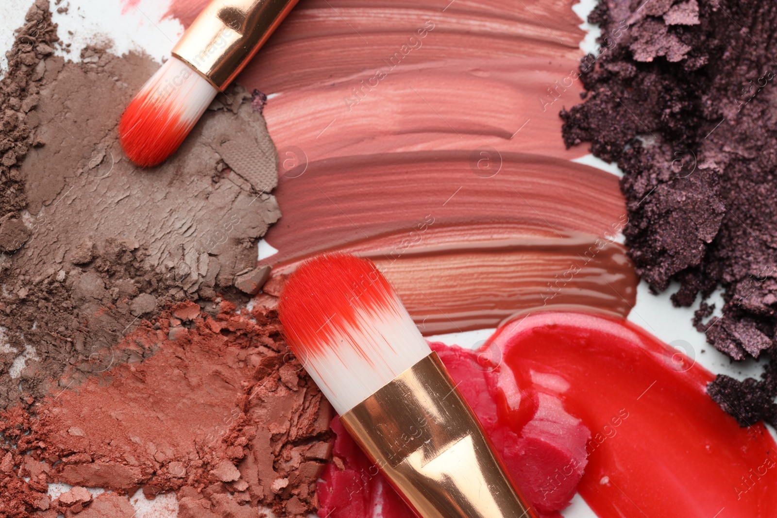 Photo of Different cosmetic products and makeup brushes on white background, flat lay