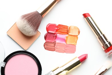 Photo of Different cosmetic products and makeup brushes on white background, flat lay