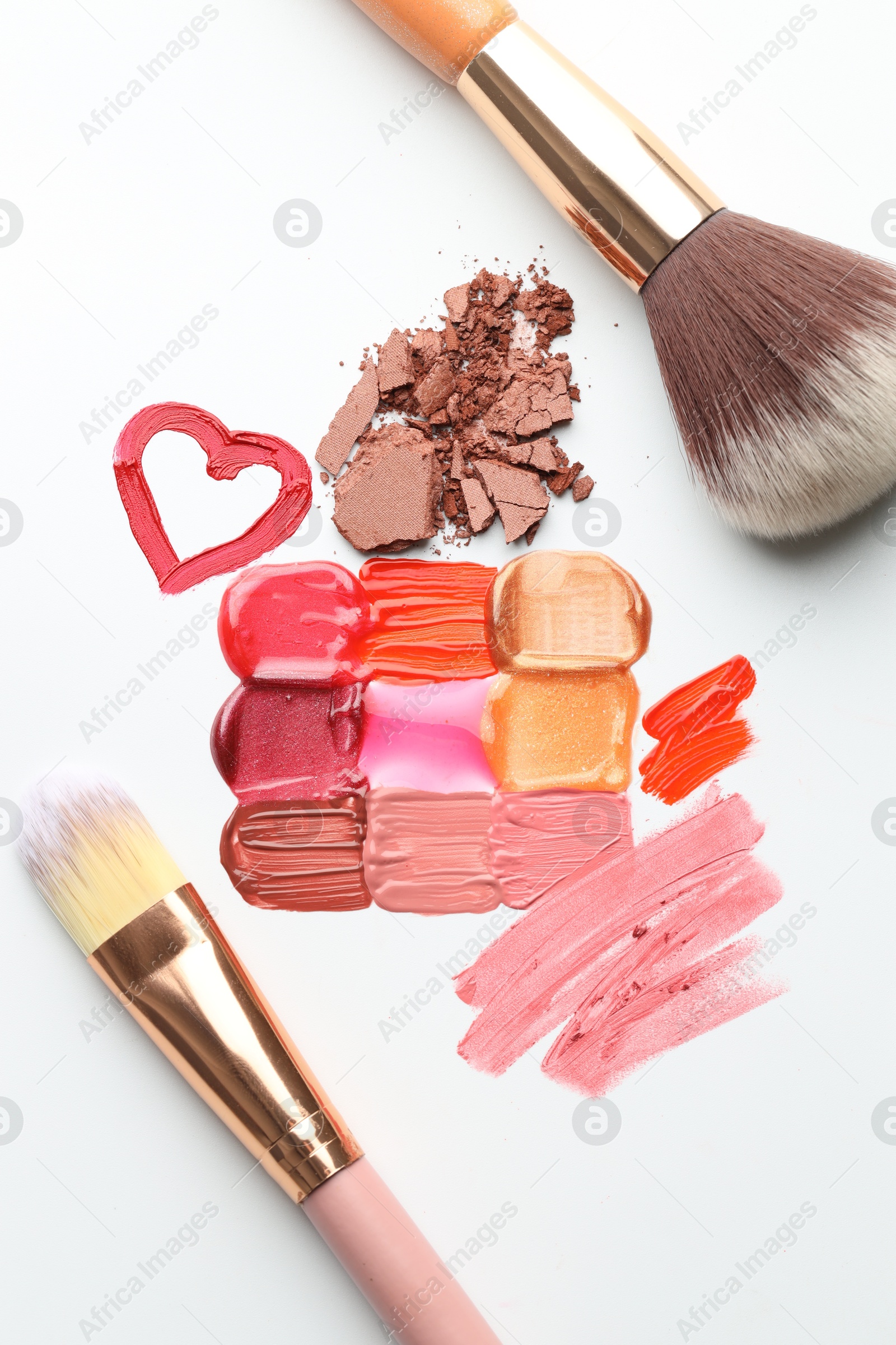 Photo of Different cosmetic products and makeup brushes on white background, flat lay