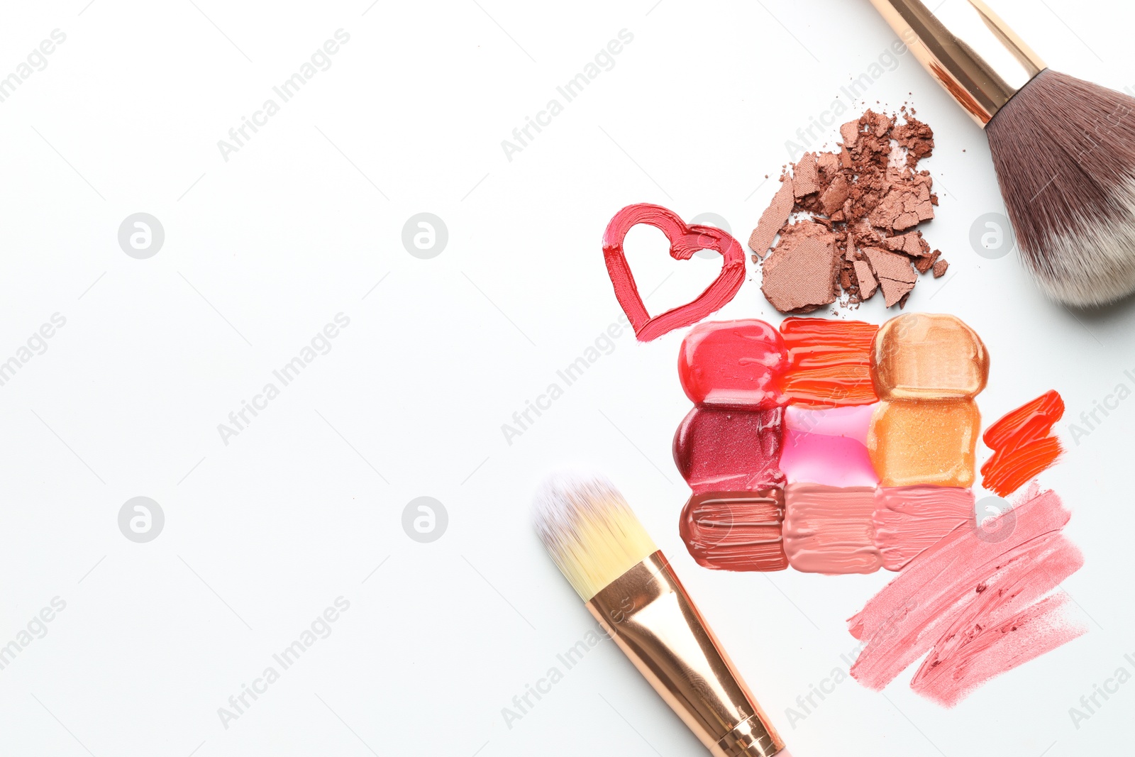 Photo of Different cosmetic products and makeup brushes on white background, flat lay. Space for text