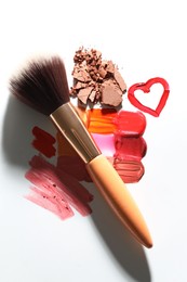 Photo of Different cosmetic products and makeup brush on white background, flat lay