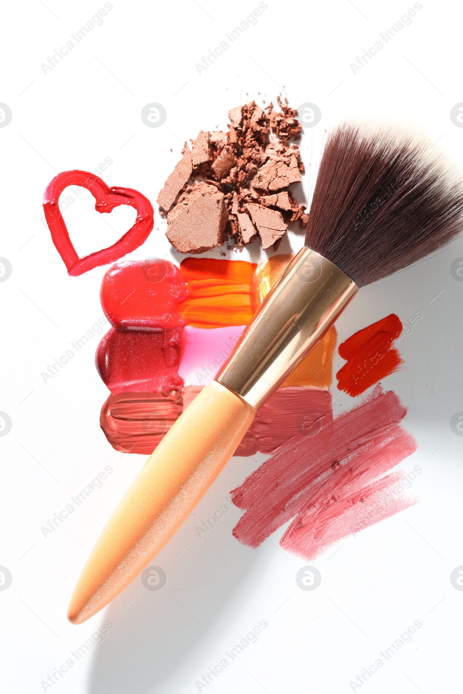 Photo of Different cosmetic products and makeup brush on white background, flat lay