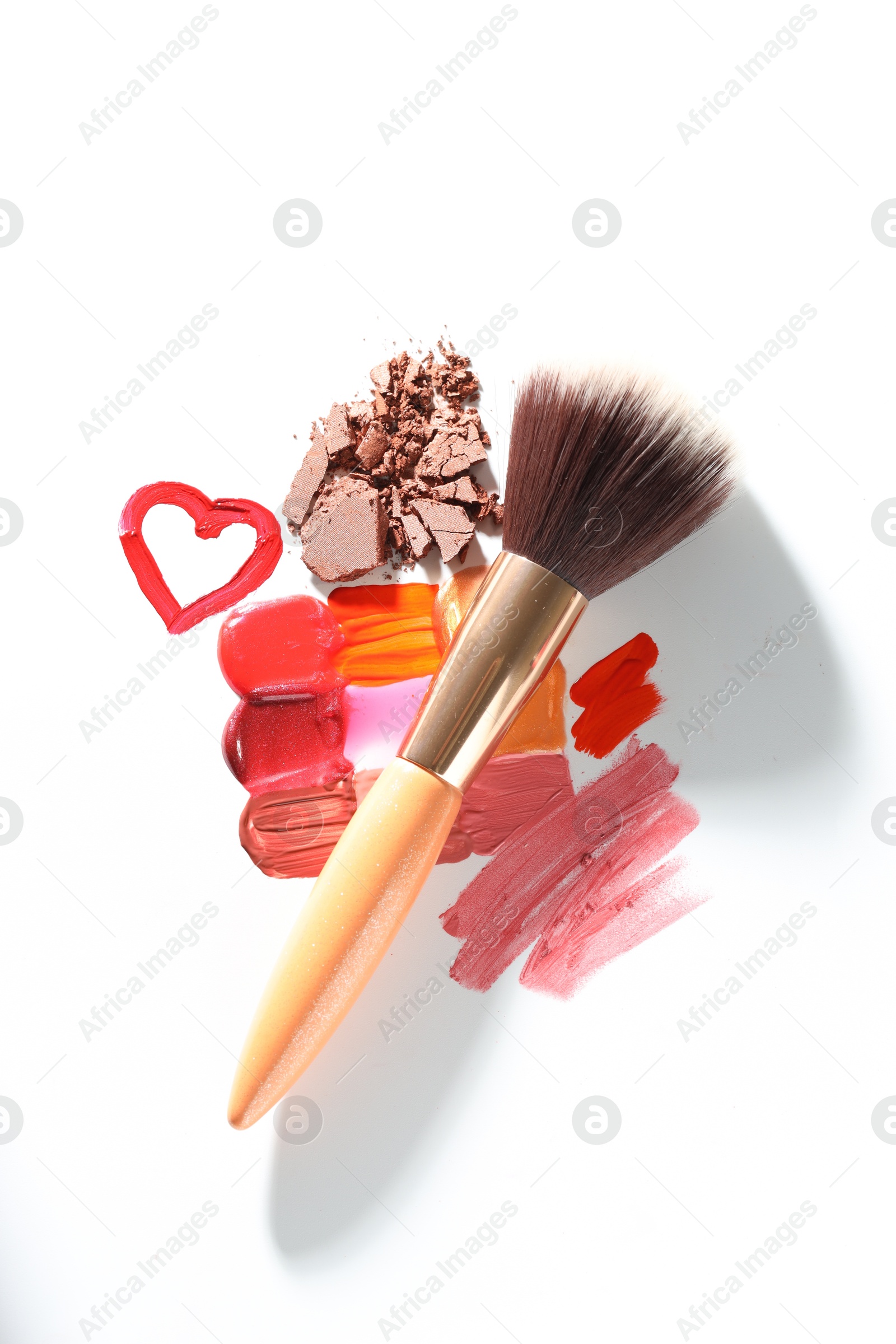 Different cosmetic products and makeup brush on white background, flat lay Photo of Different cosmetic products and makeup brush on white background, flat lay