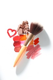 Photo of Different cosmetic products and makeup brush on white background, flat lay
