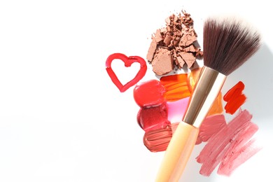 Photo of Different cosmetic products and makeup brush on white background, flat lay. Space for text