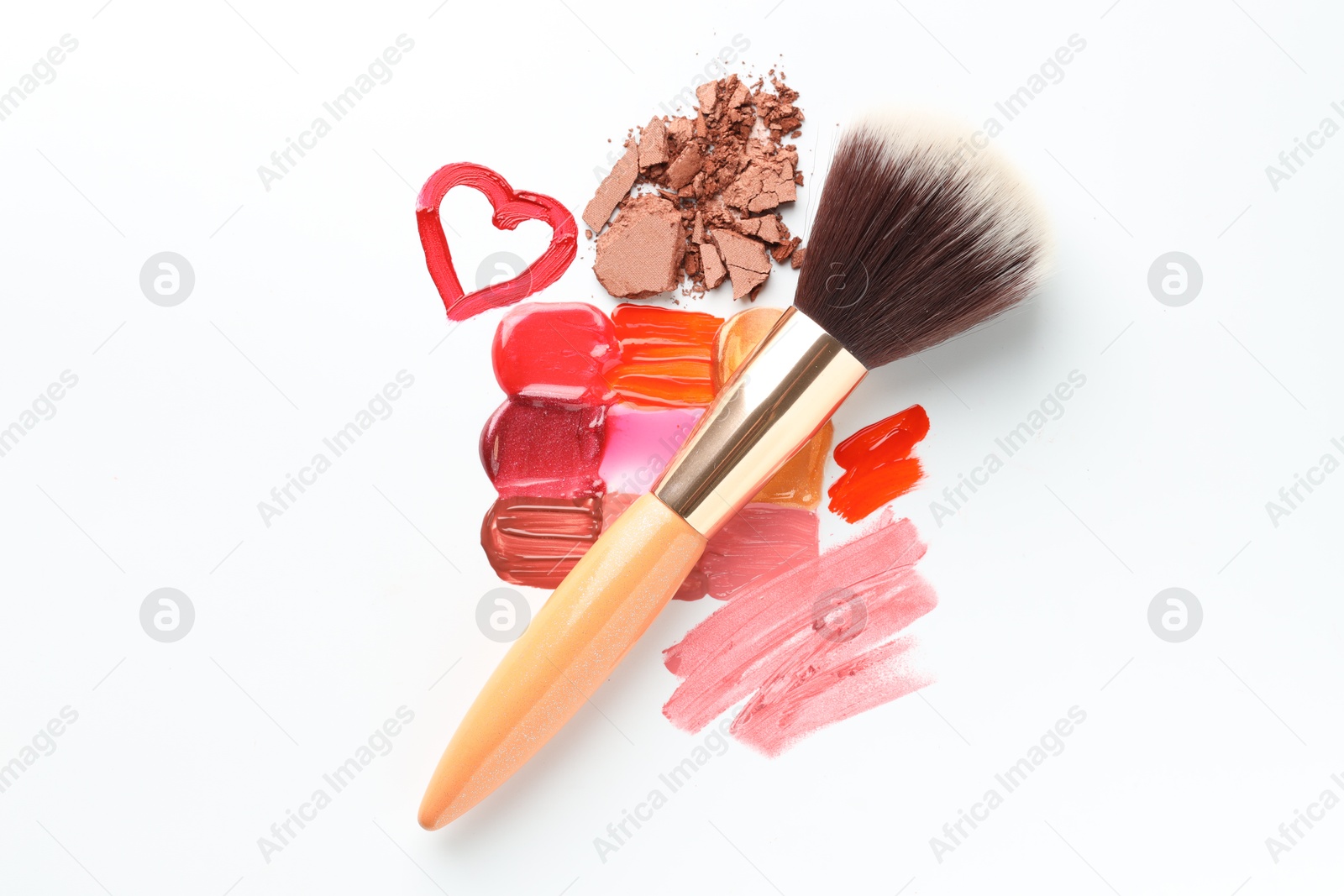 Different cosmetic products and makeup brush on white background, flat lay Photo of Different cosmetic products and makeup brush on white background, flat lay