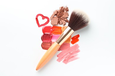 Photo of Different cosmetic products and makeup brush on white background, flat lay
