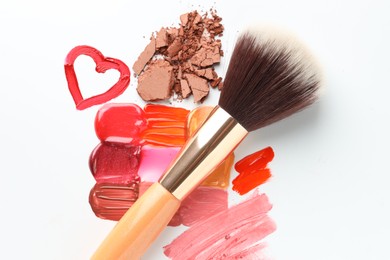 Photo of Different cosmetic products and makeup brush on white background, flat lay