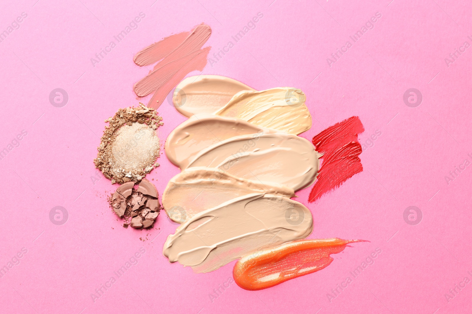 Different cosmetic products on magenta background, flat lay Photo of Different cosmetic products on magenta background, flat lay