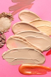 Photo of Different cosmetic products on magenta background, flat lay