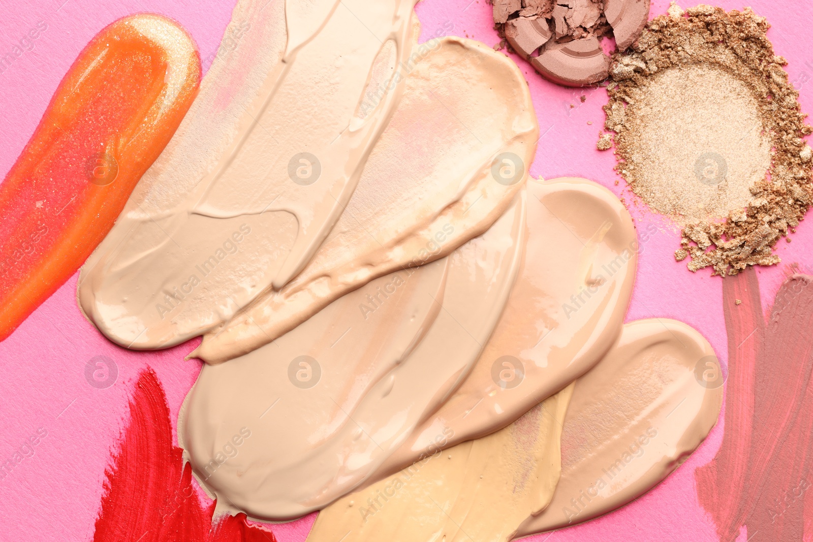 Different cosmetic products on magenta background, flat lay Photo of Different cosmetic products on magenta background, flat lay