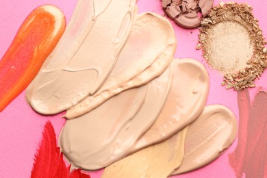 Photo of Different cosmetic products on magenta background, flat lay