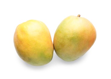 Photo of Fresh ripe mangos isolated on white, top view