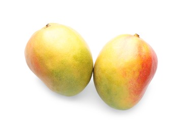 Photo of Fresh ripe mangos isolated on white, top view