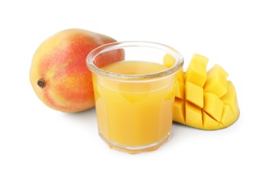 Photo of Tasty mango juice in glass and fresh fruits isolated on white
