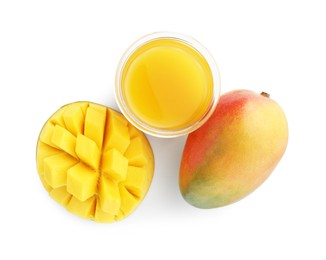 Photo of Tasty mango juice in glass and fresh fruits isolated on white