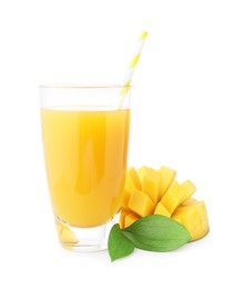 Photo of Tasty mango juice in glass and fresh fruit isolated on white