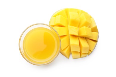 Photo of Tasty mango juice in glass and fresh fruit isolated on white, top view