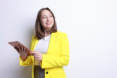 Photo of Woman with modern tablet on white background, space for text