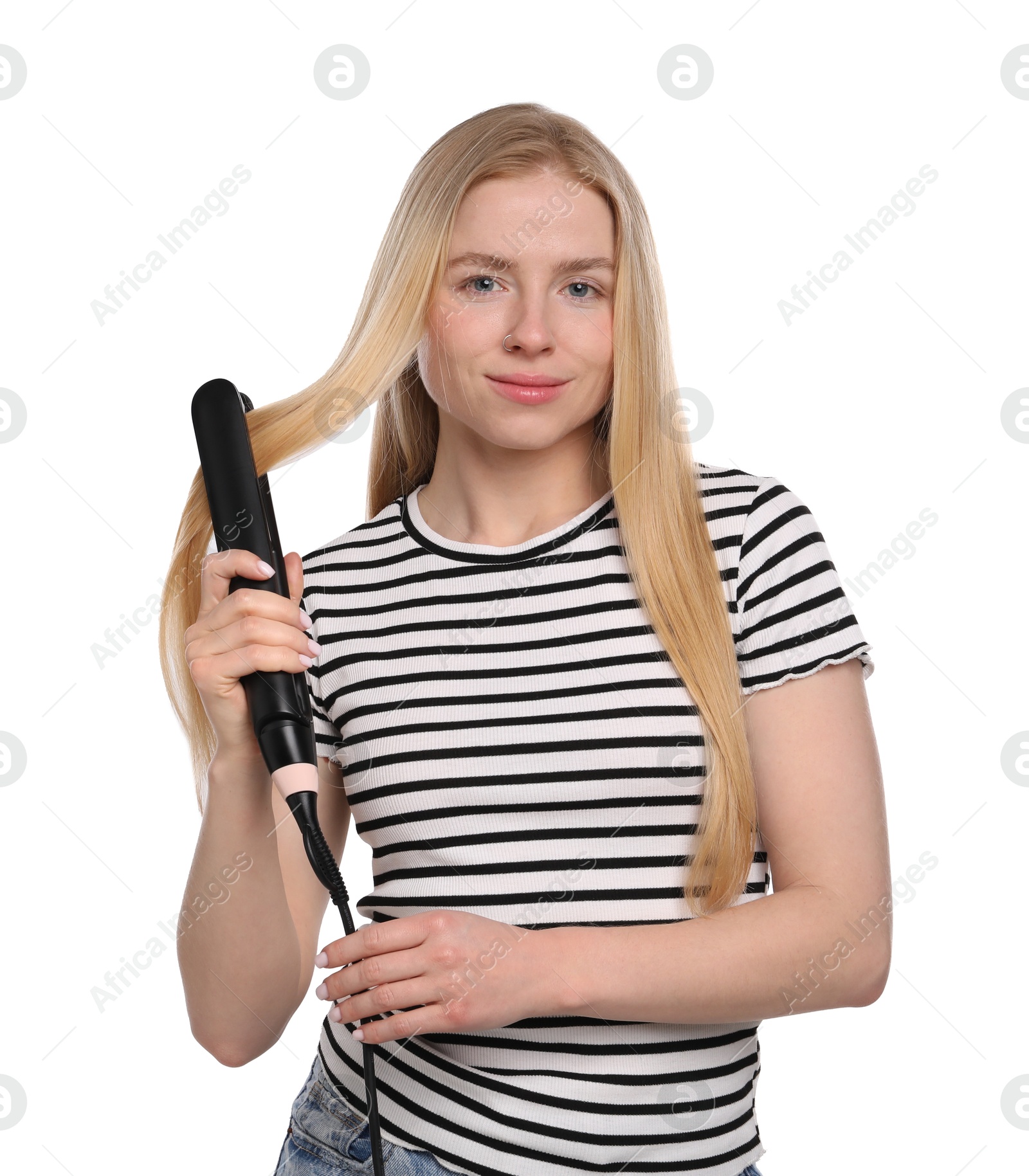 Photo of Woman straightening her hair on white background