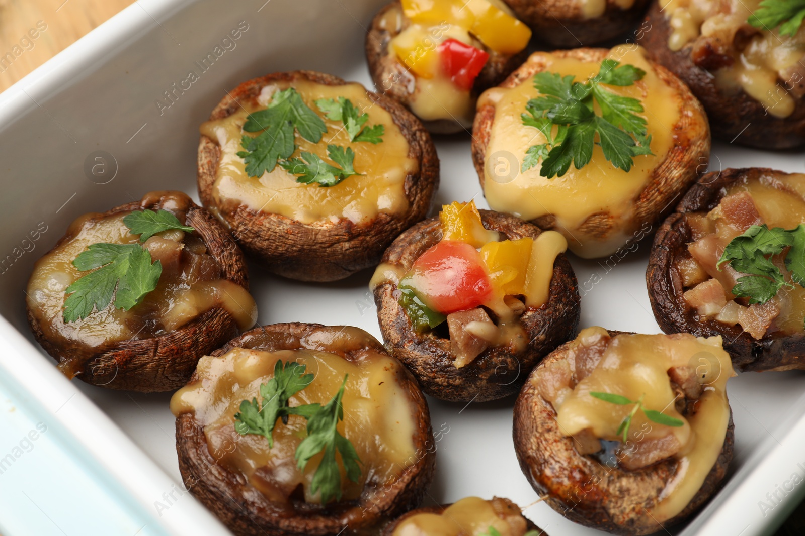 Tasty stuffed mushrooms in baking dish, above view Photo of Tasty stuffed mushrooms in baking dish, above view