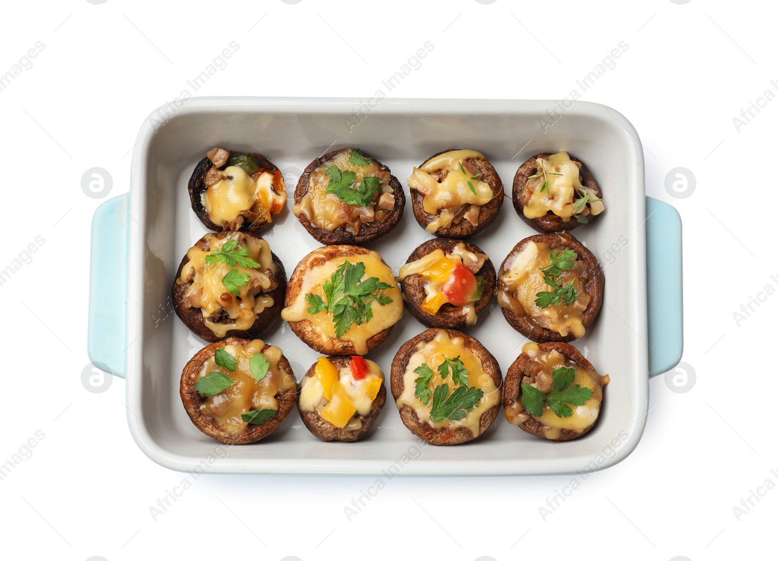 Tasty stuffed mushrooms in baking dish isolated on white, top view Photo of Tasty stuffed mushrooms in baking dish isolated on white, top view