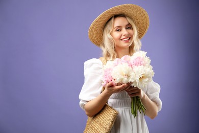 Photo of Happy woman with bouquet of beautiful peonies on purple background, space for text