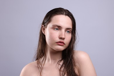 Photo of Beautiful woman with natural skin complexion on grey background, closeup