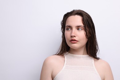 Photo of Beautiful woman with natural skin complexion on light grey background. Space for text