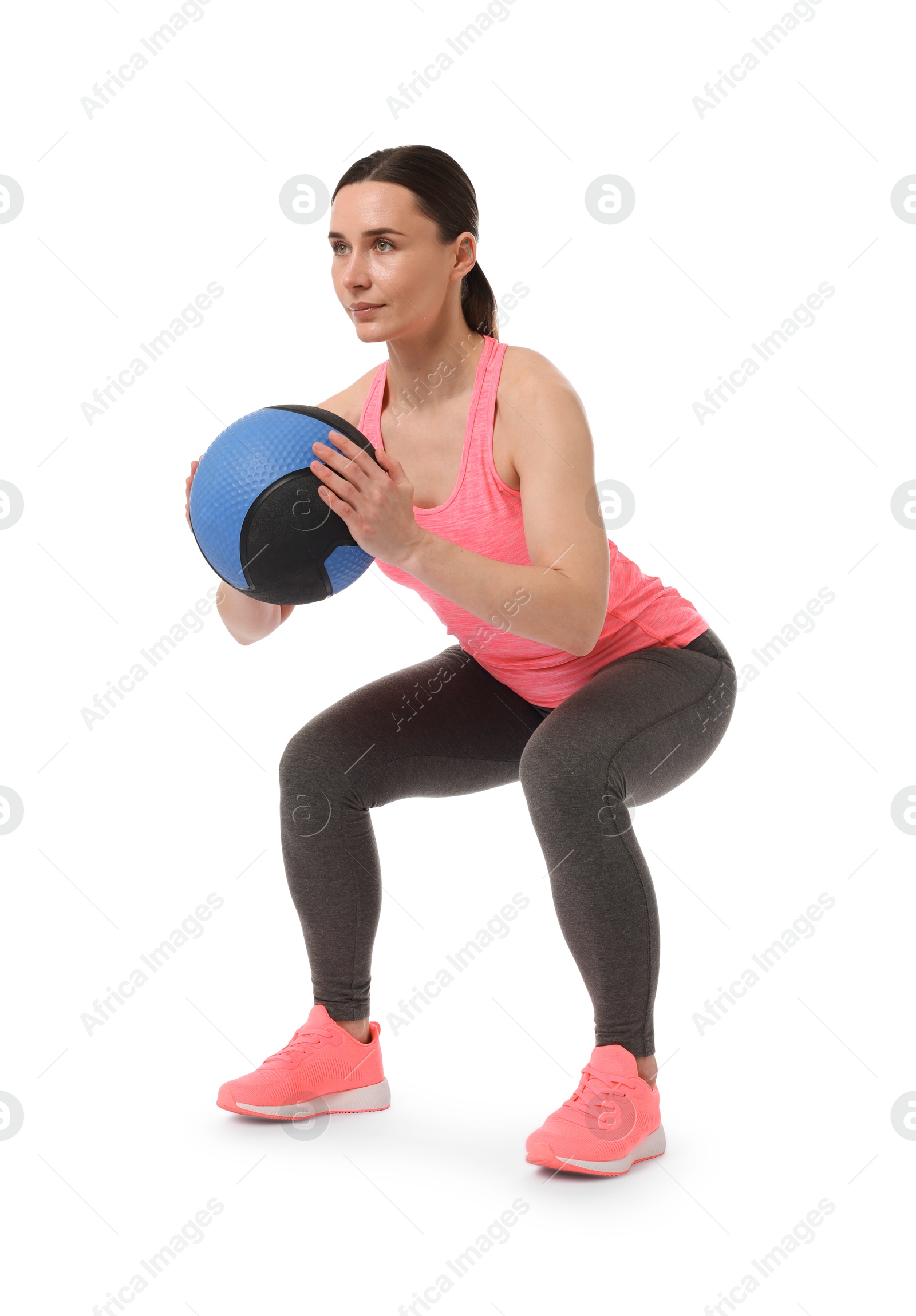 Photo of Athletic woman exercising with medicine ball on white background