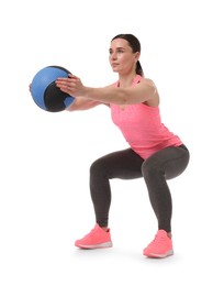 Photo of Athletic woman exercising with medicine ball on white background