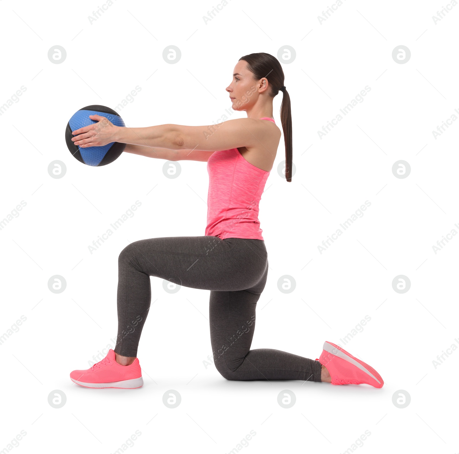 Photo of Athletic woman exercising with medicine ball on white background