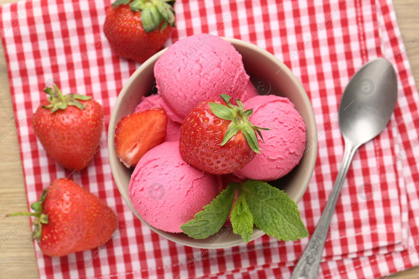 Refreshing sorbet, strawberries and mint on wooden table, top view Photo of Refreshing sorbet, strawberries and mint on wooden table, top view