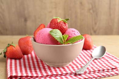 Photo of Refreshing sorbet, strawberries and mint on wooden table, closeup
