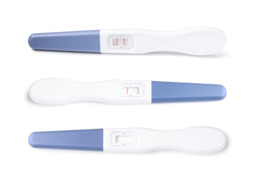 Image of Three pregnancy tests with positive, negative and invalid results isolated on white, set