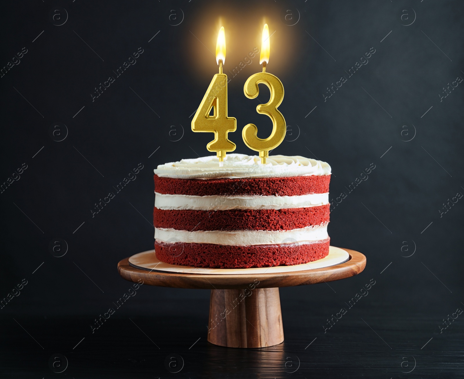 Yummy cake with burning number shaped candles on black background. 43th birthday or other special occasion Image of Yummy cake with burning number shaped candles on black background. 43th birthday or other special occasion