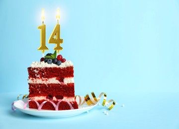 Image of Piece of cake with berries and burning number shaped candles on turquoise background, space for text. 14th birthday or other special occasion