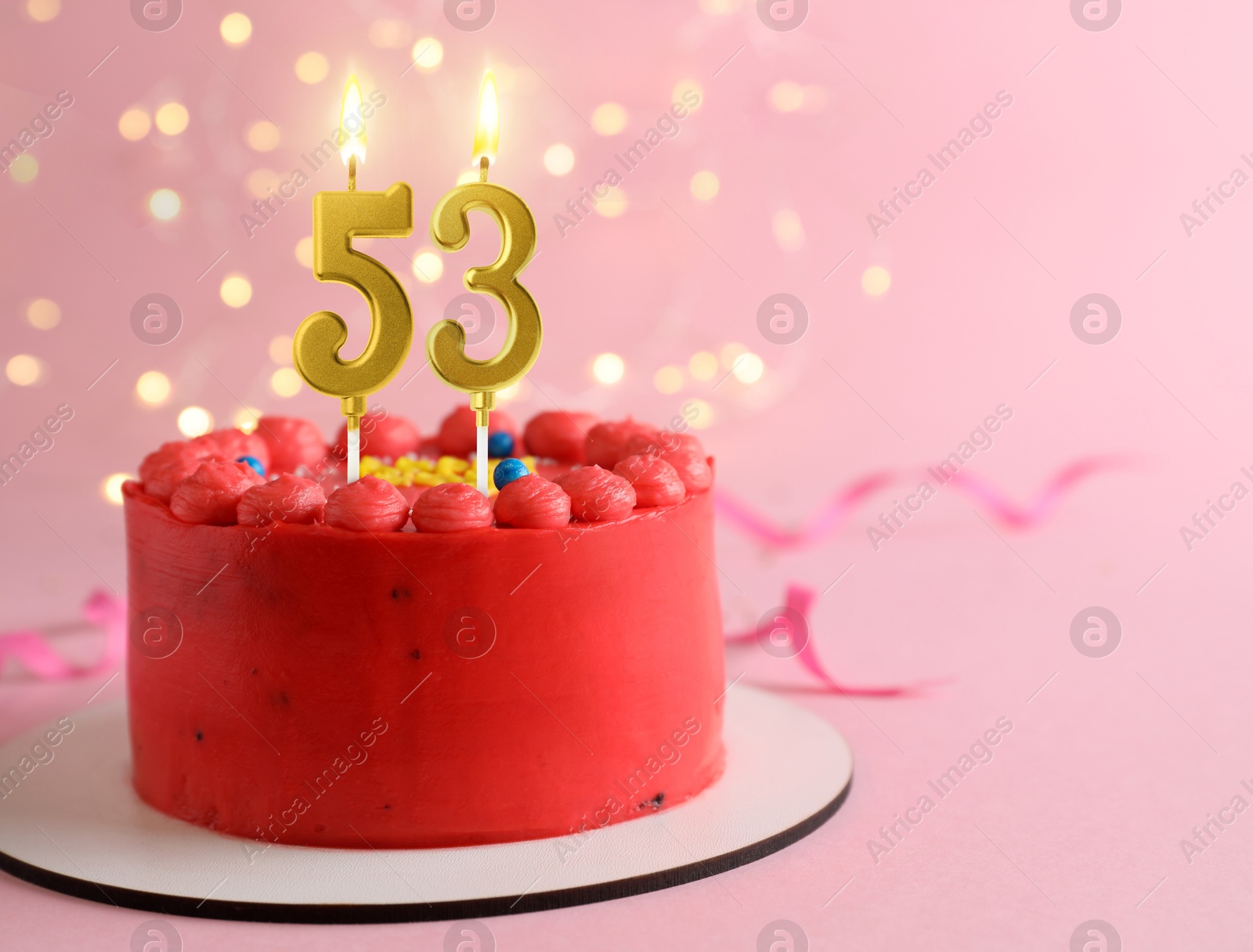 Yummy cake with burning number shaped candles on pink background with blurred lights, space for text. 53th birthday or other special occasion Image of Yummy cake with burning number shaped candles on pink background with blurred lights, space for text. 53th birthday or other special occasion