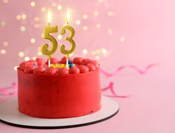 Image of Yummy cake with burning number shaped candles on pink background with blurred lights, space for text. 53th birthday or other special occasion
