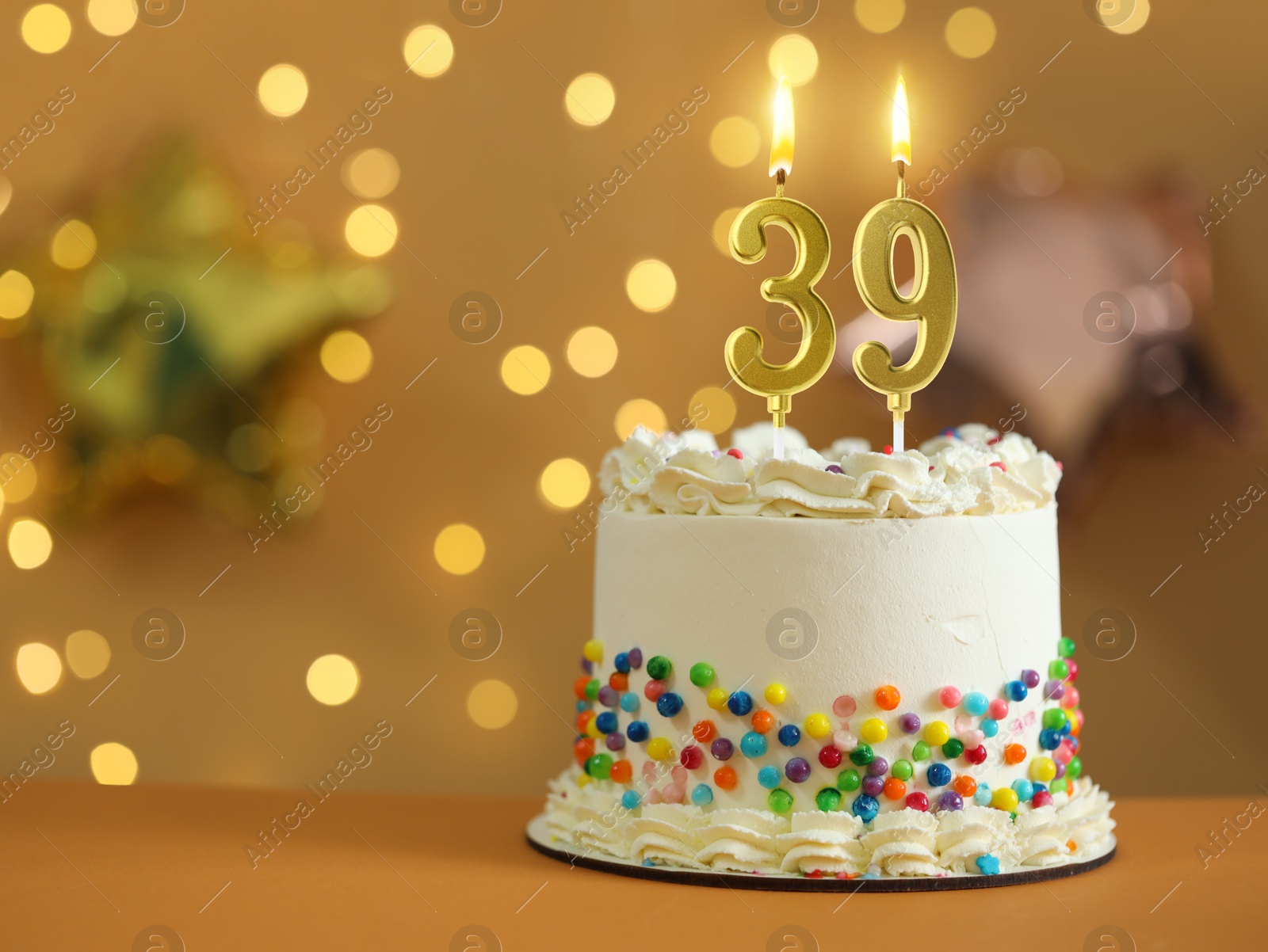 Yummy cake with burning number shaped candles against blurred lights, space for text. 39th birthday or other special occasion Image of Yummy cake with burning number shaped candles against blurred lights, space for text. 39th birthday or other special occasion