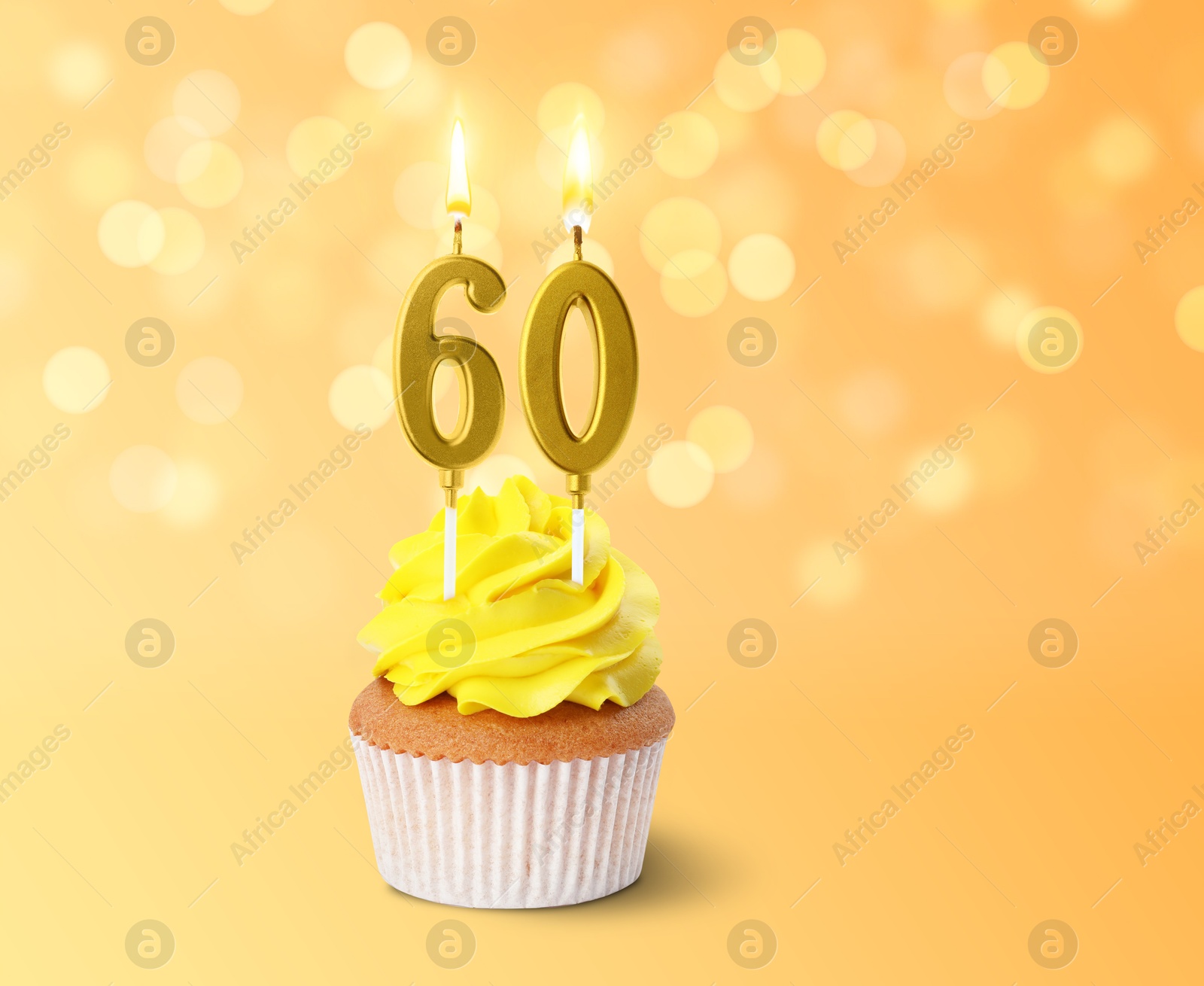 Yummy cupcake with burning number shaped candles on color gradient background with blurred lights. 60th birthday or other special occasion Image of Yummy cupcake with burning number shaped candles on color gradient background with blurred lights. 60th birthday or other special occasion