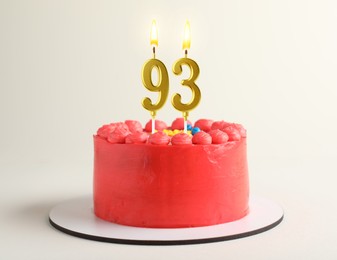 Image of Yummy cake with burning number shaped candles on white background. 93th birthday or other special occasion