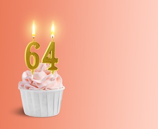 Image of Yummy cupcake with burning number shaped candles on coral gradient background, space for text. 64th birthday or other special occasion